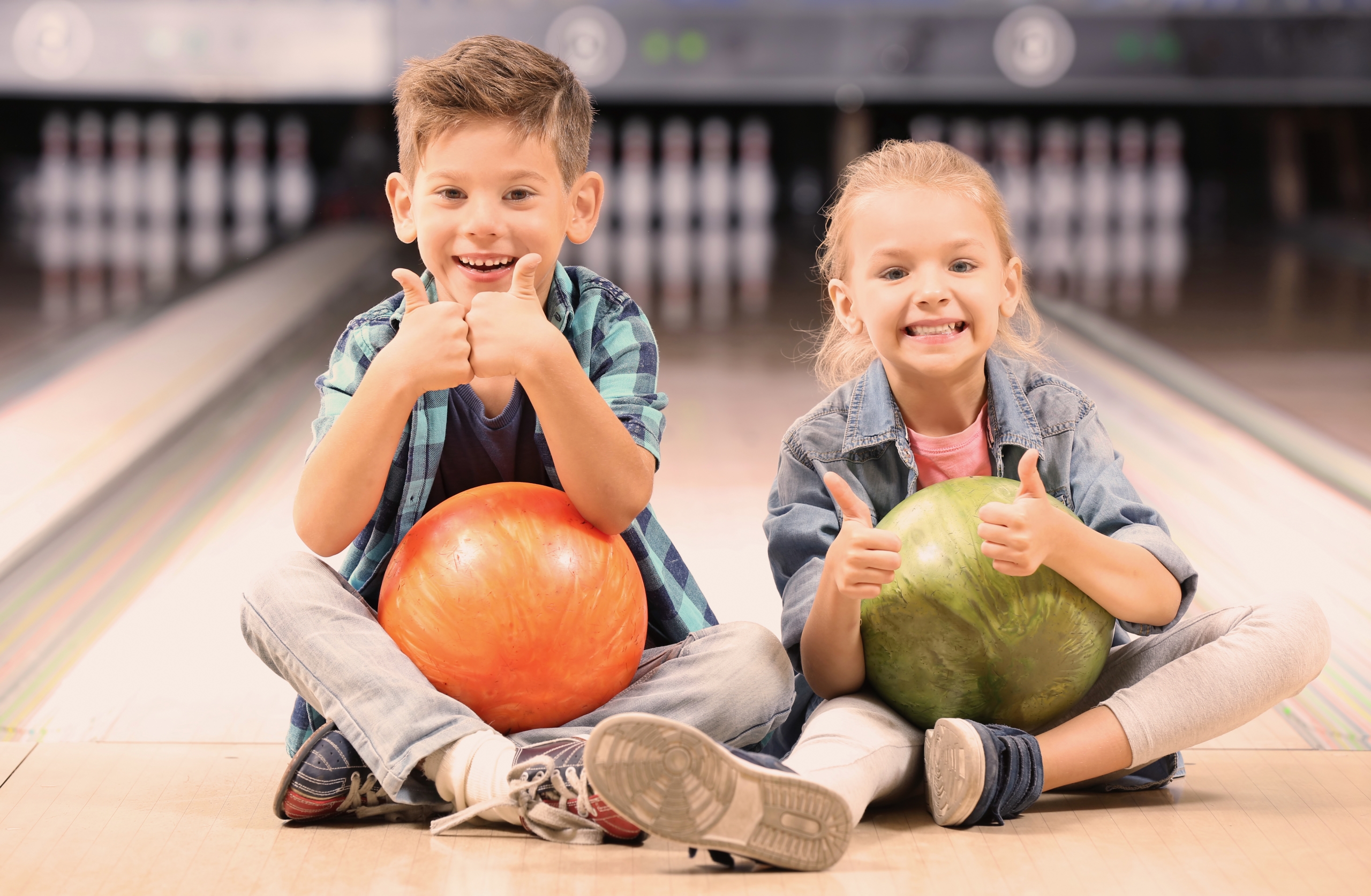 Cute little children at bowling club